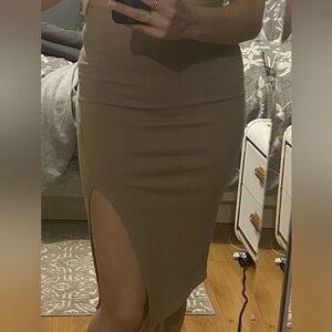 Super cute midi Body-con beige skirt, with side slit.